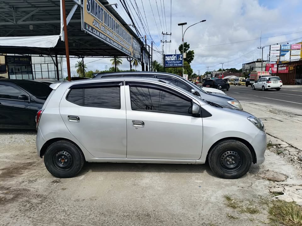 2014 DAIHATSU AYLA MOBIL BEKAS MURAH unit istimewa siap jalan